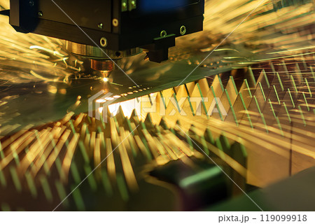 The fiber laser cutting machine  cut the metal plate with the sparkling light. 119099918