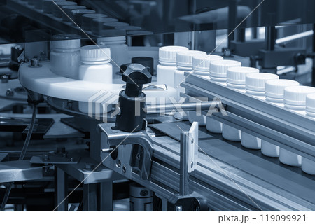 The medicine bottle filling process in the light blue scene. 119099921