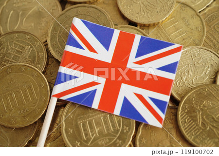 United Kingdom flag on gold coins money, finance trading investment business currency. 119100702