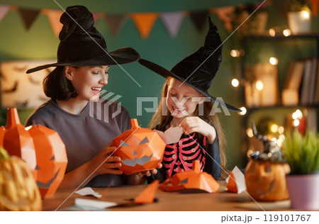 Happy family preparing for Halloween. Happy family preparing for Halloween. 119101767