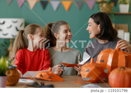Happy family preparing for Halloween. 119101796