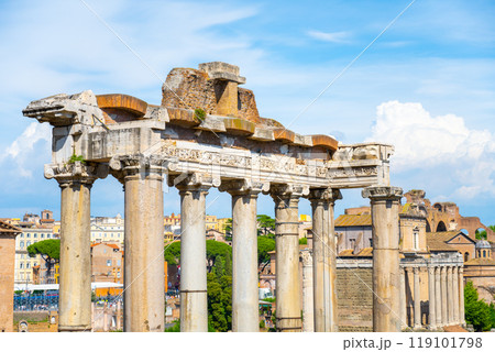 Exploring the ancient ruins of the Saturn Temple located in the Roman Forum, Rome. The remnants showcase impressive columns against a clear blue sky, reflecting the grandeur of ancient architecture. Exploring the ancient ruins of the Saturn Temple located in the Roman Forum, Rome. The remnants showcase impressive columns against a clear blue sky, reflecting the grandeur of ancient architecture. 119101798
