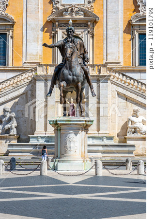 The captivating equestrian statue of Marcus Aurelius stands prominently on Capitoline Hill, showcasing the emperor in a commanding pose against the backdrop of ancient architecture. The captivating equestrian statue of Marcus Aurelius stands prominently on Capitoline Hill, showcasing the emperor in a commanding pose against the backdrop of ancient architecture. 119101799