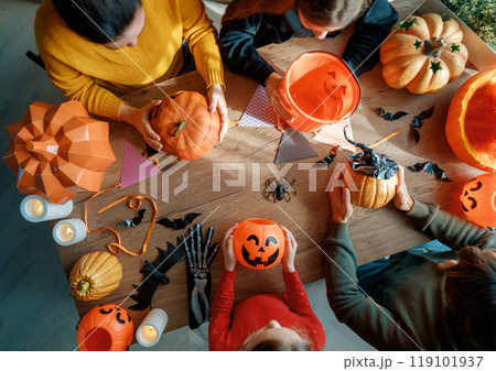 Happy family preparing for Halloween. Happy family preparing for Halloween. 119101937