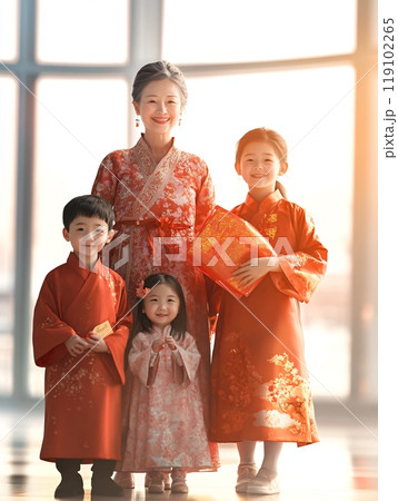 Cheerful Chinese Family Celebrating in Traditional Red Attire with Young Children 119102265