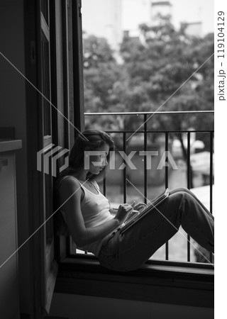 A contemplative and serene moment while sitting on the balcony, reflecting on life 119104129