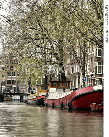 Traditional boats and canals in Amsterdam, Netherlands, Europe Traditional boats and canals in Amsterdam, Netherlands, Europe 119106295