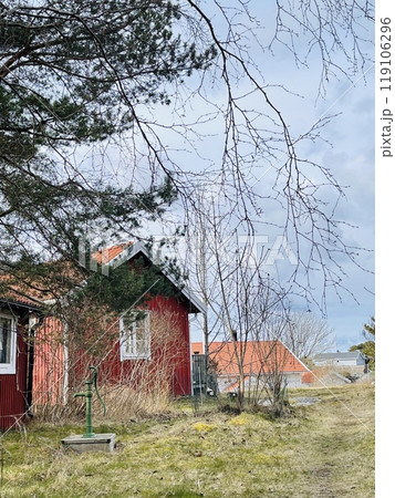 A view of red wooden houses on Donso Archipelago island . A view of red wooden houses on Donso Archipelago island . 119106296