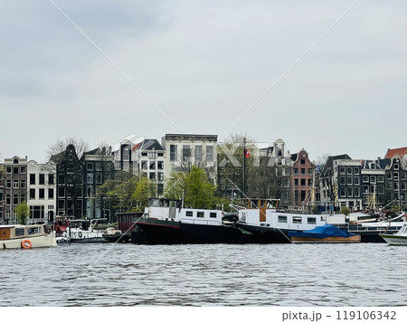 Traditional boats and canals in Amsterdam, Netherlands, Europe 119106342