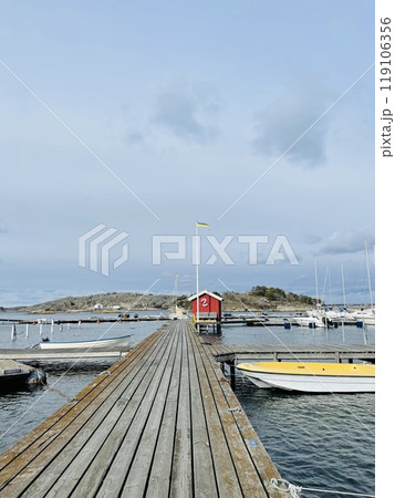A view of red wooden houses on Donso Archipelago island . A view of red wooden houses on Donso Archipelago island . 119106356