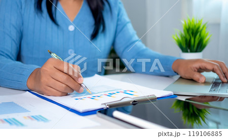 Businesswoman show paper documents to analyze business and manage corporate data, Business analytics with charts KPIs to improve organizational performance, Marketing and financial strategy. 119106885