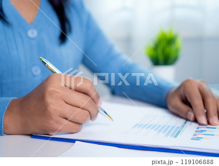 Businesswoman show paper documents to analyze business and manage corporate data, Business analytics with charts KPIs to improve organizational performance, Marketing and financial strategy. 119106888