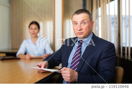 Woman boss firing upset adult male employee Woman boss firing upset adult male employee 119110048
