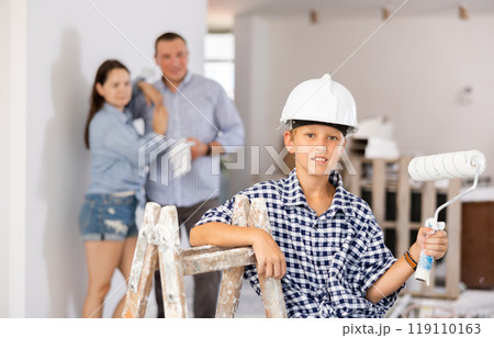 Portrait of boy during renovation at home 119110163