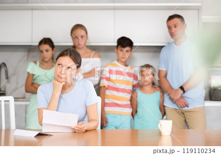 Thoughtful woman reading letter Thoughtful woman reading letter 119110234