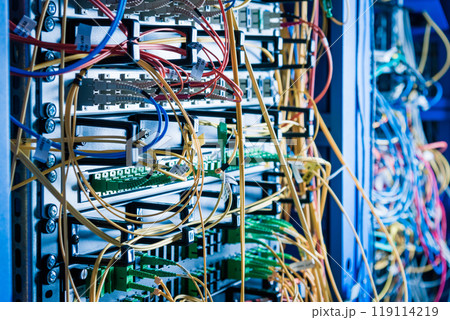 detail of server rack with fiber optic cables attached to front detail of server rack with fiber optic cables attached to front 119114219