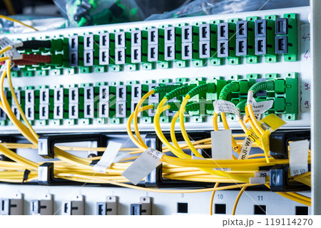 server rack with switch boards and cables 119114270