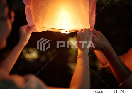 Romantic Couple Launching Chinese Lantern 119117435