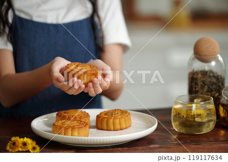 Girl With Homemade Moon Cakes 119117634