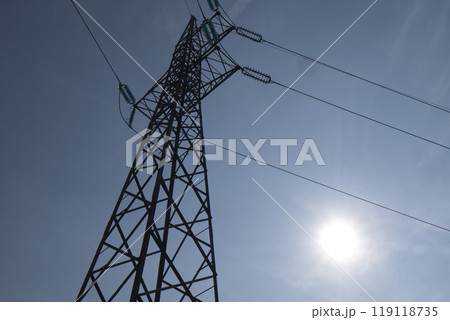 HIgh voltage transmission network silhouette over the sky HIgh voltage transmission network silhouette over the sky 119118735