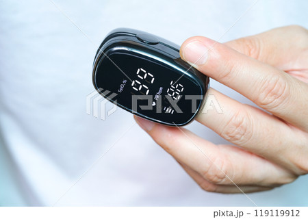 A device to measure the oxygen saturation of a person at the fingertips. And checking oxygen depletion is an emergency sign of pneumonia caused by the COVID-19 virus. A device to measure the oxygen saturation of a person at the fingertips. And checking oxygen depletion is an emergency sign of pneumonia caused by the COVID-19 virus. 119119912