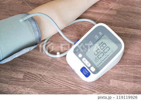 man checking blood pressure monitor and heart rate monitor and he High blood pressure, blood pressure 180, check the pressure with a digital pressure gauge. health and medical concepts man checking blood pressure monitor and heart rate monitor and he High blood pressure, blood pressure 180, check the pressure with a digital pressure gauge. health and medical concepts 119119926