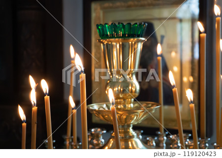 Burning Candles in a Lampada in an Orthodox Church 119120423