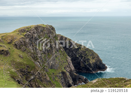 Cliffside view near Slieve League with rugged rocks green slopes and Atlantic Ocean 119120518