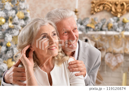 couple old and mature seniors enjoying and having fun together celebrating the new year  119120874