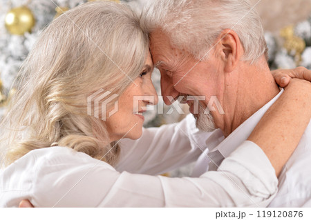 couple old and mature seniors enjoying and having fun together celebrating the new year  119120876