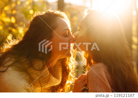 Portrait of happy mother and daughter in autumn forest at sunset. . Autumn women. Portrait of happy mother and daughter in autumn forest at sunset. . Autumn women. 119121107