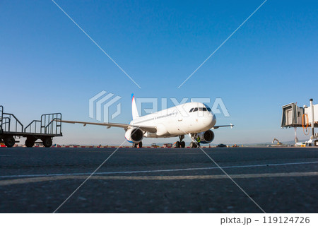 Passenger aircraft preparing to ground handling on the airport 119124726