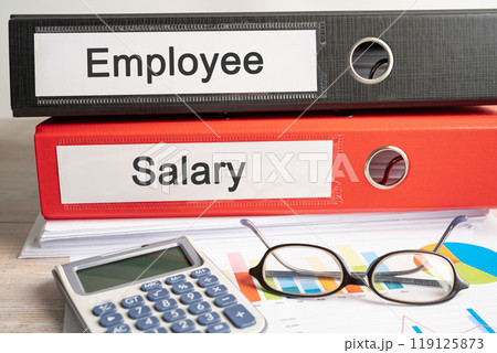Payroll overtime. Binder data finance report business with graph analysis in office. Payroll overtime. Binder data finance report business with graph analysis in office. 119125873