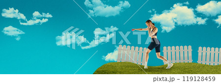 Young focused woman boxing with dumbbells in hands, training with blue sky and clouds above. Creative art collage. Young focused woman boxing with dumbbells in hands, training with blue sky and clouds above. Creative art collage. 119128459