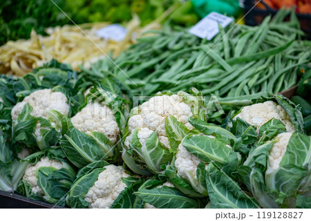 Fresh vegetables displayed on a farmer's market counter Fresh vegetables displayed on a farmer's market counter 119128827