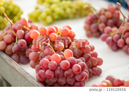 grapes displayed on a farmer's market counter grapes displayed on a farmer's market counter 119128938