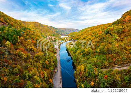 mountain river at sunset. landscape of romania in autumn. somes river in apuseni mountains in fall season. beautiful scenery of european countryside. colorful outdoor environment mountain river at sunset. landscape of romania in autumn. somes river in apuseni mountains in fall season. beautiful scenery of european countryside. colorful outdoor environment 119128965
