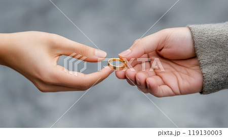Hands Exchanging a Gold Ring Symbolizing Commitment and Connection, AI 119130003