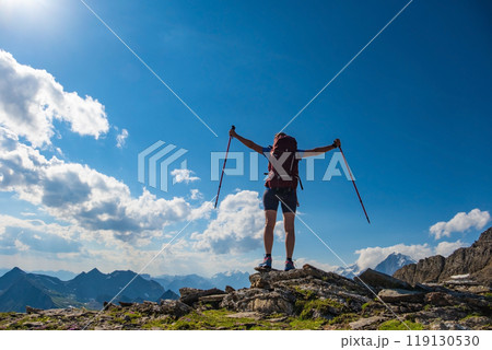 Sporty woman hiking in Switzerland alps. Heathy lifestyle, sport, beauty in nature. Grindelwald valley, Swizz Sporty woman hiking in Switzerland alps. Heathy lifestyle, sport, beauty in nature. Grindelwald valley, Swizz 119130530