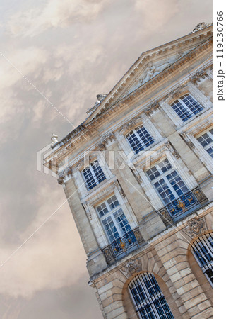 Classic French mansion and cloudy sky on background 119130766