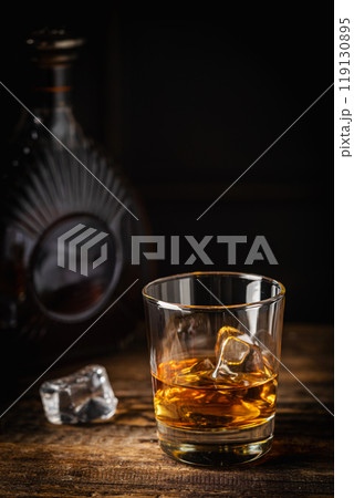 Whiskey with ice in glasses Whiskey with ice in glasses 119130895