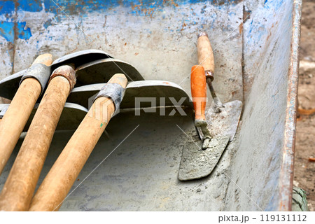 Scoop shovels and trowels in the construction wheelbarrow 119131112