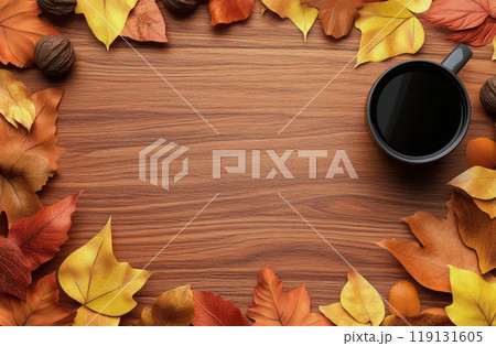 Cozy autumn scene with colorful leaves and a steaming cup on a wooden table 119131605