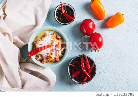 Spicy creamy mexican salsa in a bowl on the table top view 119132799