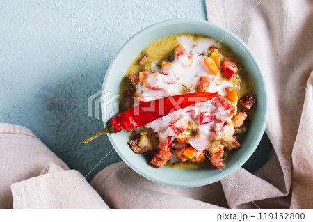 Close up of spicy creamy mexican salsa in a bowl on the table top view 119132800