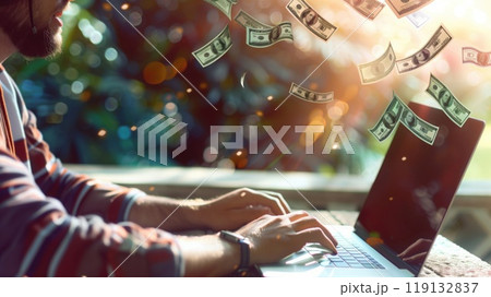 A large plan of a person's hands near an open laptop with money pouring out. The concept of freelancing and quick money 119132837