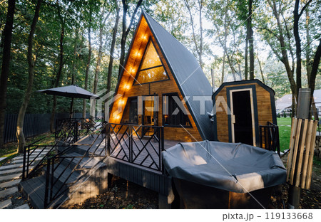 Cozy A-frame cabin with outdoor patio, sauna, and hot tub, surrounded by a peaceful forest retreat Cozy A-frame cabin with outdoor patio, sauna, and hot tub, surrounded by a peaceful forest retreat 119133668