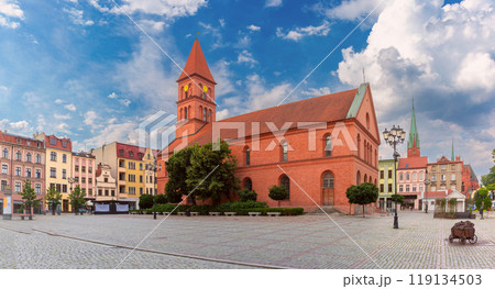 Holy Church of Catherine of Alexandria against a background of blue sky with clouds Torun, Poland 119134503
