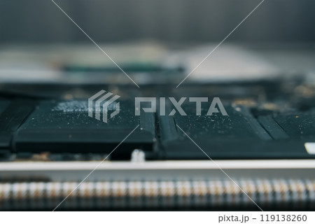 A detailed view of a laptop battery along with its intricate circuitry, showcasing the various electronic components A detailed view of a laptop battery along with its intricate circuitry, showcasing the various electronic components 119138260