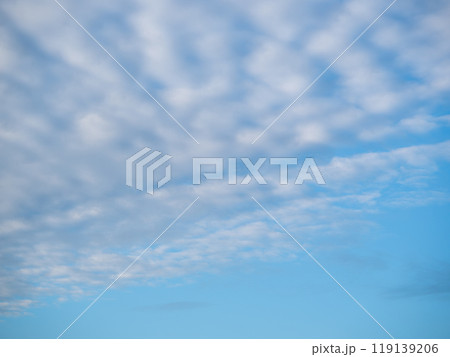 Beautiful blue sky with unusual white Altocumulus undulatus clouds 119139206